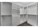 Well-organized walk-in closet with ample shelving, drawers, and hanging space for clothing and accessories at 6012 Chessington Ave, Las Vegas, NV 89131