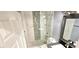 A remodeled bathroom with a walk-in shower featuring beautiful tiling and a modern design at 6348 Blue Twilight Ct, Las Vegas, NV 89108