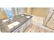 Modern bathroom featuring double sinks, granite countertops, and walk-in shower at 6348 Blue Twilight Ct, Las Vegas, NV 89108