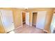 Bright bedroom featuring wood-look floors, open closet, and light fixture at 6348 Blue Twilight Ct, Las Vegas, NV 89108