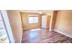 A bedroom with hardwood floors, natural light from the window, and a decorative chandelier at 6348 Blue Twilight Ct, Las Vegas, NV 89108