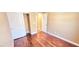 Cozy bedroom featuring warm wood flooring and a closet with sliding doors at 6348 Blue Twilight Ct, Las Vegas, NV 89108
