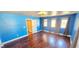 Bright bedroom with hardwood floors, large windows and an elegant light fixture at 6348 Blue Twilight Ct, Las Vegas, NV 89108