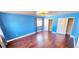 This large primary bedroom has hardwood floors, generous windows and ample closet space at 6348 Blue Twilight Ct, Las Vegas, NV 89108