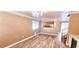 Open-concept dining area with hardwood floors, crown molding, and light fixture at 6348 Blue Twilight Ct, Las Vegas, NV 89108