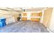 Garage includes cabinets, overhead storage rack, and a side entrance at 6348 Blue Twilight Ct, Las Vegas, NV 89108