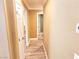 Neutral hallway with doors leading to other rooms featuring wood-look flooring at 6348 Blue Twilight Ct, Las Vegas, NV 89108
