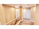Spacious hallway with staircase and vinyl flooring, next to a large closet at 6348 Blue Twilight Ct, Las Vegas, NV 89108