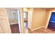 Hallway with wood and vinyl flooring leading to bedrooms with natural light at 6348 Blue Twilight Ct, Las Vegas, NV 89108