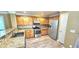 Modern kitchen featuring wood cabinets, granite counters, and stainless steel appliances at 6348 Blue Twilight Ct, Las Vegas, NV 89108