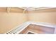 A walk-in closet with white shelving installed at 6348 Blue Twilight Ct, Las Vegas, NV 89108
