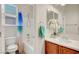 Bathroom features a vanity with single sink, shower over tub, and toilet at 7216 Campolina Ct, Las Vegas, NV 89113