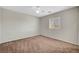Bedroom with neutral carpet, a window and white walls at 7216 Campolina Ct, Las Vegas, NV 89113
