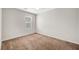 Bedroom with a large window and neutral carpet at 7216 Campolina Ct, Las Vegas, NV 89113