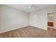 Bedroom with a ceiling fan and access to the bathroom at 7216 Campolina Ct, Las Vegas, NV 89113