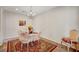 Elegant dining room featuring chandelier, area rug, and neutral walls creating a welcoming atmosphere at 7216 Campolina Ct, Las Vegas, NV 89113
