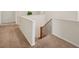 View of the second floor hallway with carpet, staircase, and plant at 7216 Campolina Ct, Las Vegas, NV 89113