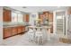 Kitchen with island and white bar stools, granite counters, and stainless appliances at 7216 Campolina Ct, Las Vegas, NV 89113