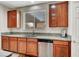 Kitchen boasts granite countertops, stainless steel appliances and wooden cabinetry at 7216 Campolina Ct, Las Vegas, NV 89113