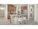 Kitchen features granite counters, stainless steel appliances and island with barstool seating at 7216 Campolina Ct, Las Vegas, NV 89113
