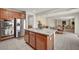 Kitchen island with granite countertops and stainless appliances leads to dining area at 7216 Campolina Ct, Las Vegas, NV 89113
