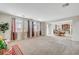 Open concept living room, seamlessly connecting to the dining area at 7216 Campolina Ct, Las Vegas, NV 89113
