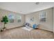 Loft featuring neutral colors, bright natural light, and stylish seating at 7216 Campolina Ct, Las Vegas, NV 89113