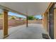 Covered patio showcases elegant columns, concrete flooring, and a view of backyard at 7216 Campolina Ct, Las Vegas, NV 89113