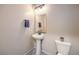 Half bathroom with pedestal sink and modern fixtures at 7477 Onyx Star St, North Las Vegas, NV 89084