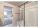 Bright bathroom with tiled shower, vanity with sink, and tiled floors at 7477 Onyx Star St, North Las Vegas, NV 89084