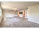 Large bonus room features ceiling fan, recessed lights, carpet, and sliding barn doors at 7477 Onyx Star St, North Las Vegas, NV 89084