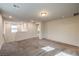 Carpeted bonus room area with small windows and ample lighting at 7477 Onyx Star St, North Las Vegas, NV 89084