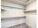 Walk-in closet with shelving, rod, and carpeted floor at 7477 Onyx Star St, North Las Vegas, NV 89084