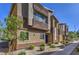 Contemporary home featuring well-maintained landscaping, modern architectural details, and a paved walkway at 7477 Onyx Star St, North Las Vegas, NV 89084