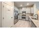 Charming kitchen featuring granite counters, stainless steel appliances, and a walk-in pantry at 7477 Onyx Star St, North Las Vegas, NV 89084