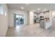 Open floor plan includes modern kitchen with stainless appliances at 7477 Onyx Star St, North Las Vegas, NV 89084