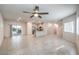 Spacious living area showcases recessed lights, large tile floors, and an open floorplan at 7477 Onyx Star St, North Las Vegas, NV 89084