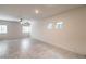 Spacious living room with ceiling fan and bright windows at 7477 Onyx Star St, North Las Vegas, NV 89084