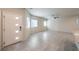 Open-concept living room boasts neutral paint, recessed lighting, and large tile flooring at 7477 Onyx Star St, North Las Vegas, NV 89084