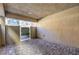 Covered patio featuring a paver floor, privacy fencing, and a gate leading to a backyard area at 7477 Onyx Star St, North Las Vegas, NV 89084