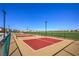 Pickleball courts at the community park, surrounded by grass and residential housing at 7477 Onyx Star St, North Las Vegas, NV 89084