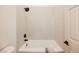 Clean bathroom featuring a bright white tub and shower with a tile surround and a handheld shower head at 7695 Silver Wells Rd, Las Vegas, NV 89149