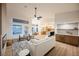 Bright, open living space with modern furnishings and a seamless flow to the kitchen at 7695 Silver Wells Rd, Las Vegas, NV 89149