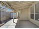 Covered patio with string lights and block wall in backyard, offering an outdoor living space at 8329 Telescope Peak Ct, Las Vegas, NV 89145