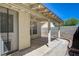 Backyard featuring a covered patio, block wall, and pet door, creating a functional outdoor space at 8329 Telescope Peak Ct, Las Vegas, NV 89145