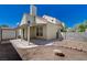 Backyard with a covered patio and low-maintenance landscaping, perfect for relaxing or entertaining at 8329 Telescope Peak Ct, Las Vegas, NV 89145