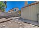 View of backyard featuring covered patio, block wall, and desert landscaping at 8329 Telescope Peak Ct, Las Vegas, NV 89145