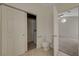 Bathroom featuring a toilet, closet, tile floors, and an entrance to the bedroom at 8329 Telescope Peak Ct, Las Vegas, NV 89145
