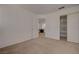 Neutral bedroom with carpeted floors, open doorway, and closet with sliding doors at 8329 Telescope Peak Ct, Las Vegas, NV 89145