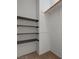 Organized walk-in closet with built-in shelving and a rod, maximizing storage space at 8329 Telescope Peak Ct, Las Vegas, NV 89145